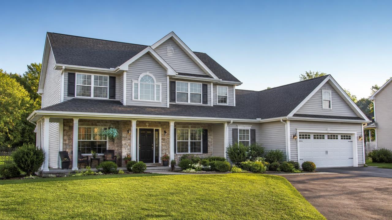 Suburban home with a newly replaced charcoal shingle roof
